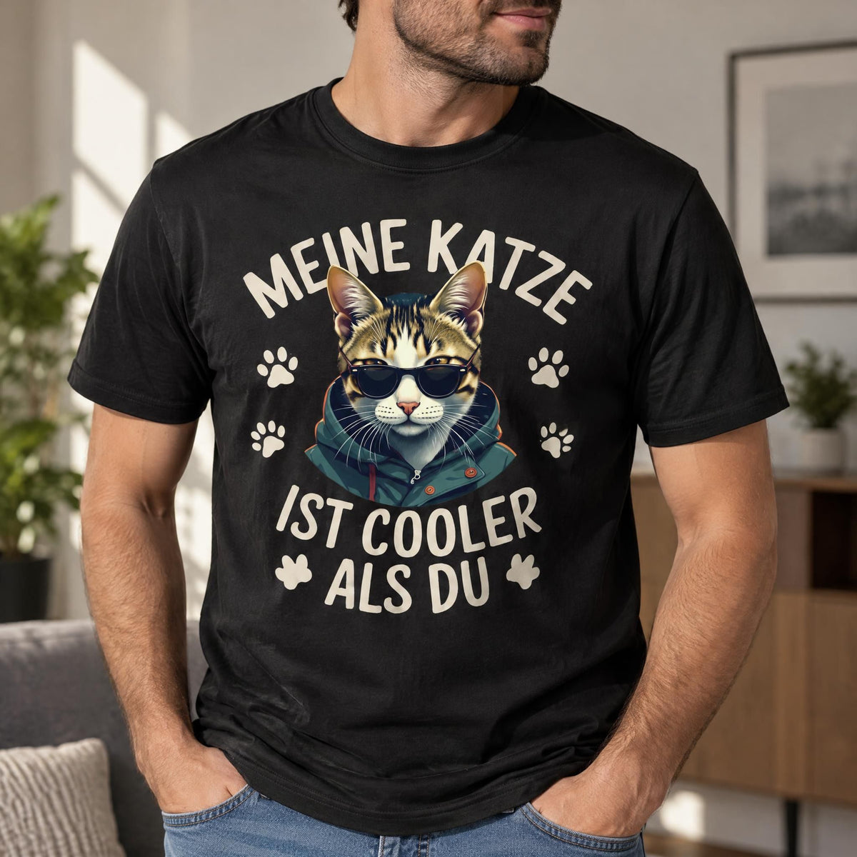 Graphic cotton t-shirt featuring a cat wearing sunglasses and a hoodie, shown in a close-up with visible fabric texture.